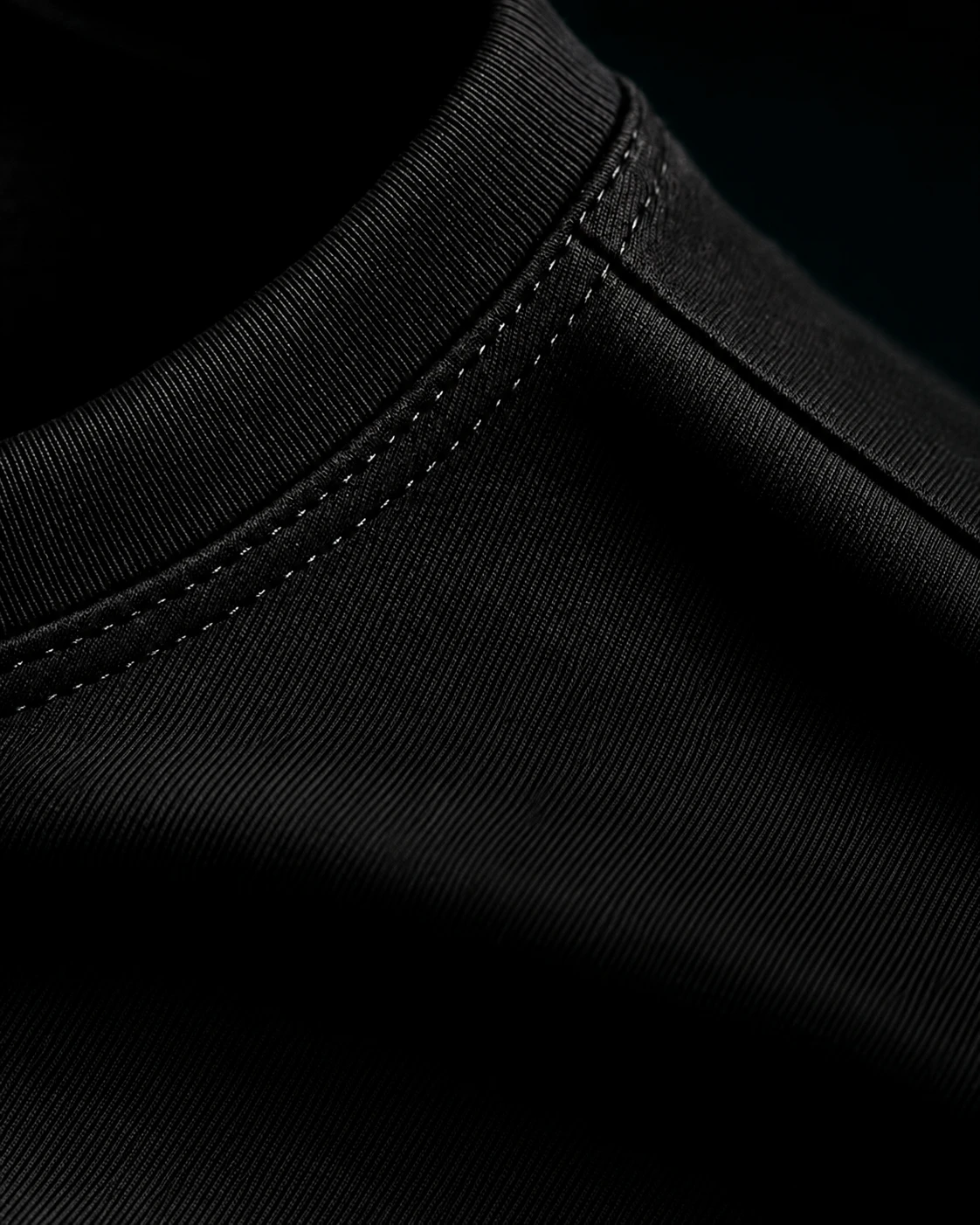 Close-up of the stitched collar on a black tee