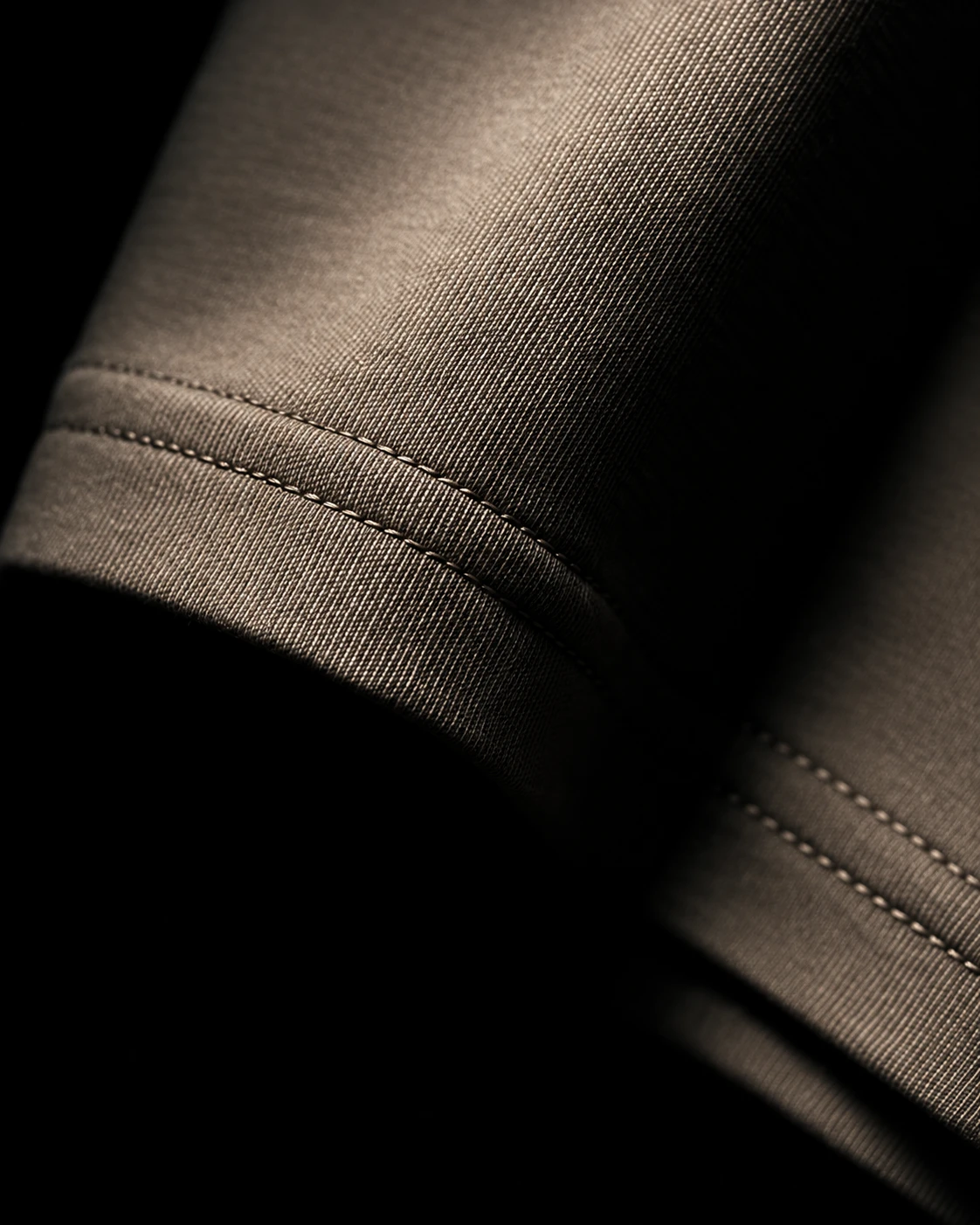 Close-up of the heavyweight cotton fabric and double-stitched sleeve hem